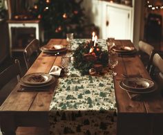 a table set with place settings for christmas dinner