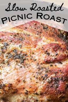 a close up of a piece of meat on a plate with the words slow roasted picnic roast