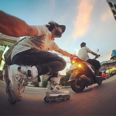 two people riding motorcycles on a city street