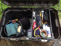 an open toolbox filled with tools and other items