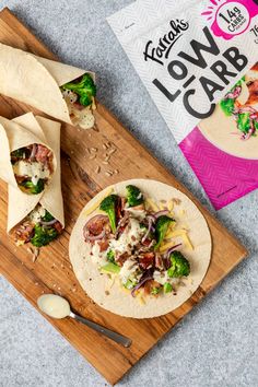 tortilla wrap with broccoli, cheese and other toppings on a cutting board