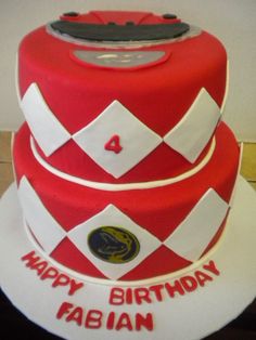 a red and white birthday cake with the number four on it's top tier