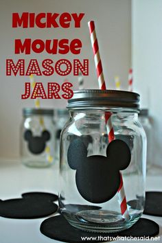 mickey mouse mason jars with straws in them