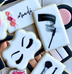 decorated cookies with makeup and eye shadows on them