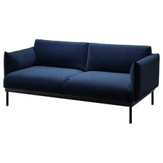 a blue couch sitting on top of a white floor next to a black metal frame