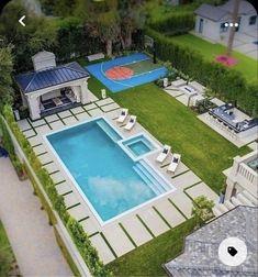 an aerial view of a backyard with a swimming pool