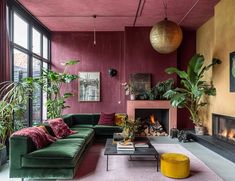 a living room filled with furniture and a fire place