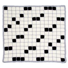 a black and white rug with squares on it