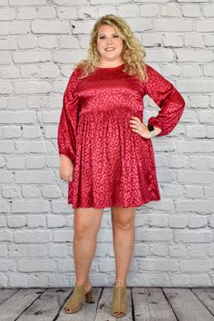 Bring out your inner animal with the Satin Animal Print Long Sleeve Babydoll Dress in Plus Size by Umgee Clothing. This dress features a stunning, yet subtle, jacquard leopard print. It has a sheen finish on a non-sheer backing. Available in a choice of black and burgundy, you can choose the best color to suit your complexion and the occasion. The dress has an empire line waist, which flows out into a flowing but mini skirt for a cute, babydoll silhouette. It also has long sleeves, which are loo Umgee Clothing, Long Sleeve Babydoll Dress, Cute Boutiques, Best Color, Babydoll Dress, Fashion Boutique, Baby Dolls, Mini Skirt, Leopard Print