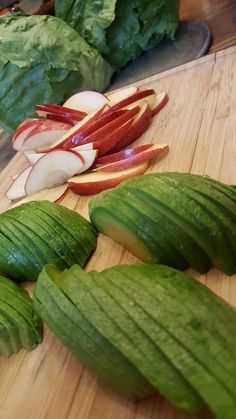 some sliced up vegetables are sitting on a cutting board next to each other and ready to be cut into wedges