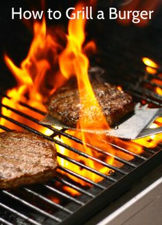 hamburgers being grilled on the grill with flames