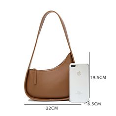 This small genuine leather shoulder bag, known for its trendy half moon design, boasts a two-layer cowhide material and a practical zipper opening. Additionally, it features a wide shoulder strap, a soft handle for comfortable carrying, and a three-dimensional outer bag design. The leather's oil side processing adds a touch of medium hardness to the bag, making it a must-have for any stylish woman. Trendy Brown Baguette Bag With Single Shoulder Strap, Modern Brown Bag With Single Shoulder Strap, Modern Shoulder Bag With Single Strap For Daily Use, Modern Handheld Satchel With Single Shoulder Strap, Modern Single Strap Shoulder Bag For Daily Use, Trendy Brown Hobo Bag With Single Shoulder Strap, Trendy Handheld Soft Leather Shoulder Bag, Trendy Soft Leather Baguette Bag For Office, Trendy Soft Leather Baguette Satchel Bag