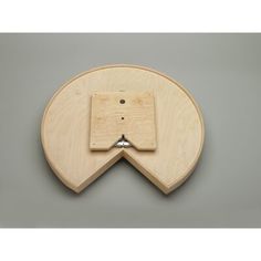 an object made out of plywood with a metal hook on it's side