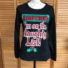 Caution I’m On The Naughty List! Christmas T-Shirt For Juniors. Nwot Black Christmas Graphic Tee, Black Holiday Tops With Letter Print, Black Holiday Top With Letter Print, Black Tops With Letter Print For Holiday, Black Christmas Tops With Text Print, Black Tops With Text Print For Christmas, Black Text Print Top For Christmas, Black Crew Neck Top For Holiday, Tops Long Sleeve