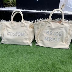 two bride and groom bags sitting on the grass