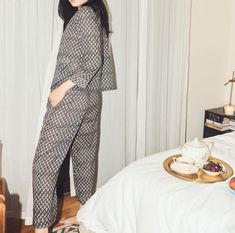 The Rosie Top, made from the airiest lightweight cotton voile, is ideal for slow mornings lounging in bed. With a button front closure and loose, boxy fit, this top highlights details like the piping hem trim and delicate dotted print. The Rosie top sits perfectly with our Rosie Pant to create the sweetest sleep set. Pictured paired with the Rosie Pajama Pant Features: Button front closure Piping trim finishing on the edges Front patch pockets Faded Black/Cream Dot¬†print Fit: Relaxed & boxy Fit Adult Pajamas Party, Pajama Party Outfit, Top Highlights, Tomboy Look, Bohemian Lifestyle, Pajama Pant, Sleepwear Sets, Sleep Set, Sleepwear & Loungewear