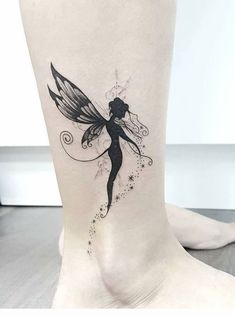 a woman's foot with a small fairy tattoo on the side of her leg