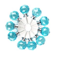 an image of a blue glass beaded brooch with silver metal pins on white background