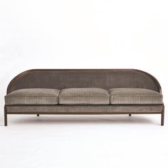 Tailored Sofa is distinguished by the sleek pinstripe fabric around the back support. A beautiful wooden base supports the sofa and is accentuated along the bottom edge with a filet of solid brass running around the entire frame of the sofa. Elegant shapely legs and frame are finished in a dark waxed oiled walnut finish. Dimensions Overall 95.75"W x 32"H x 28.75"D (130 lbs) Leg 7.25"H  Weight Limit - 300 lbs per seat (900 lbs total) Solid Beech Brass Trim 33% Polester, 51% Cotton, 16% Acrylic  F Global Views Furniture, Sofa Elegant, Pinstripe Fabric, Unique Sofas, Brown Pinstripe, Dark Wax, Global Views, Brown Sofa, Back Support