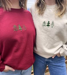 Handmade embroidered Christmas tree sweatshirt from Threads by Layne on Etsy, created by two sisters and inspired by nature and the beauty of each season. Our Christmas Tree Crewneck is the perfect minimal holiday design for holiday lovers like us. This one-of-a-kind design is made with lots of time and love so there is a limited quantity available.  Available in two colors: red and beige  Sizes S-4XL How to care for your hand embroidered crewneck: - Wash inside out on the delicate setting and hang it up to dry <3 All products are made to order, specially created with you in mind. Because of this, the designs might be slightly different than the photos, but the overall design is the same and the quality is top notch. Support small businesses, and shop our made-to-order styles. Feel free to Christmas Sweatshirts Embroidery, Red Sweatshirt Embroidery Ideas, Christmas Embroidery Crewneck, Casual Embroidered Sweatshirt For Holiday, Holiday Embroidered Crew Neck Sweatshirt, Holiday Embroidered Casual Sweatshirt, Embroidered Christmas Holiday Sweatshirt, Christmas Tree Sweatshirt, Hand Embroidered Sweatshirt