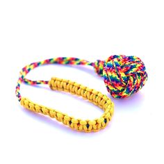 a colorful rope with a knot on it and a ball of yarn in the middle