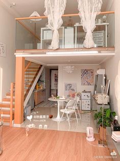 an open floor plan with stairs leading up to the upper level and dining room on the second floor