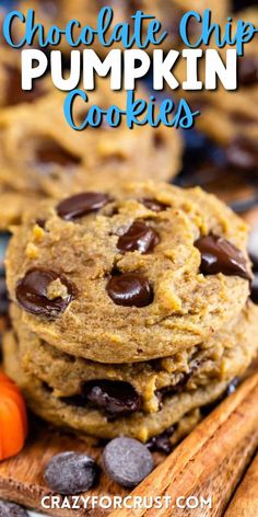 chocolate chip pumpkin cookies stacked on top of each other with cinnamon sticks in the background