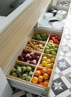 a drawer filled with lots of different types of fruits and veggies in it