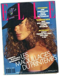 a magazine cover with a woman wearing a hat on it's head and long curly hair