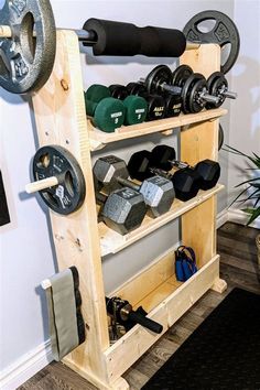 a gym equipment rack with dumbs, weights and other personal care items on it