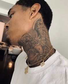 a man with a tattoo on his neck