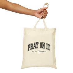 Pray On It Tote Bag | Bible Verse Tote Bag | Canvas Tote Bag | Catholic Gift Bag | Christian Gift | Religious Tote | Christian Tote Bag This stylish tote bag is perfect to use for gift giving, grocery store, and much more. Measuring at 15.75"h x 15.25"w and with a handle length of 21.5", these personalized tote bags are with 100% cotton sheeting. Add their reinforced handle stitching to the mix, and you got a reliable bag rich in both practicality and durability. Material: 100% cotton sheeting L Rectangular Bags With Letter Print, Daily Letter Print Rectangular Bag, Pray On It, Christian Tote Bags, Stylish Tote Bag, Personalized Tote Bags, Catholic Gifts, Bag Canvas, Christian Gifts