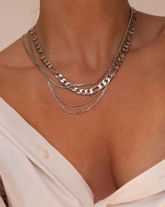 Here A Girl Has A Silver Chandon Necklace Around Her Neck Luxury Silver Chain Choker Necklace, Luxury Silver Delicate Chain Necklace, Luxury Silver Snake Chain Jewelry, Luxury Silver Chain Necklace For Gift, Luxury Oxidized Silver Chain Necklace, Luxury Silver Necklace With Delicate Chain, Luxury Silver Brass Chain Necklace, Luxury Silver Classic Chain Necklace, Luxury Timeless Silver Chain Necklace