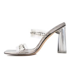 Step into elegance with the Zeta heeled mule, embellished with sparkling rhinestone clear bands. This stunning shoe is a true head-turner, perfect for special occasions where you want to shine. The sleek design and shimmering details add a touch of glamour to any outfit. Whether it's a wedding, gala, or evening event, the Zeta heeled mule ensures you'll make a sophisticated statement with every step. Elevate your style and let your feet do the talking with this exquisite pair. Rhinestone Slides, Wide Width Sandals, Heeled Mule, Brown Wedges, Stunning Shoes, Faux Leather Heels, Platform Espadrilles, New York And Company, Open Toe Shoes