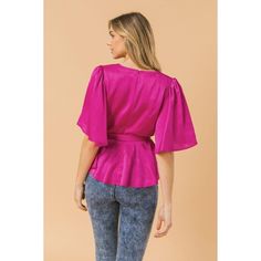 Solid satin top featuring surplice neckline, short angel sleeve, front pleats, self sash belt, peplum and back zipper closure