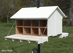 a white shed with lots of drawers on it