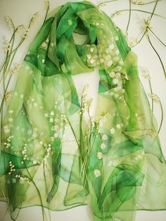 Glamourous Hand painted silk chiffon scarf - Lilies of The Valley in green. Beautiful wild flowers lovely laid out through all length long. This design Scarf is MADE TO ORDER and available in 2 SQUARE and 5 OBLONG sizes (with butterflies or without): 21*x21 inches (55x55cm)- Very small square. Can serve as a kerchief; wrist, head or bag band. 35*35 inches (90*90cm) -Possible various combinations of twisting on neck/chest. XS---59x15 inches (150x40 cm)- quite Small scarf. This size is good who li Elegant Green Scarves For Spring, Elegant Green Summer Scarves, Elegant Green Scarves For Summer, Green Dupatta For Wedding In Spring, Elegant Green Floral Silk Scarf, Elegant Green Floral Print Silk Scarf, Spring Wedding Silk Shawl, Artistic Silk Scarves For Weddings, Artistic Silk Scarves For Wedding