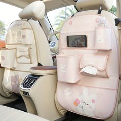 the back seat of a car with hello kitty decorations on it's side pocket