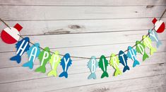 a happy birthday banner with fish on it