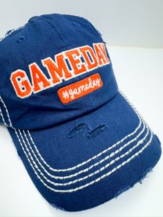 Introducing our Blue/Orange Gameday Ball Cap The perfect blend of sporty style and comfort, designed to make your game day outfit stand out. Whether you're cheering from the stands or running errands, these hats are a must-have for any fan. Key Features: Classic baseball cap design with an adjustable strap for a perfect fit High-quality, durable fabric for long-lasting wear Comfortable fit for all-day wear White stitching on hat gives it a fun look Fast shipping from Texas ensures you’re ready f Blue Fitted Cap For Game Day, Blue Sporty Snapback Hat For Game Day, Team-colored Baseball Cap For Game Day, Blue Snapback Hat For Game Day, Blue Snapback Baseball Cap For Game Day, Baseball Cap Design, Orange Games, Curvy Girl Dress, Game Day Outfit