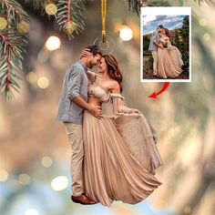 a christmas ornament with an image of a man and woman kissing on the cheek