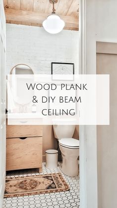 a white bathroom with wood plank and diy beam ceiling