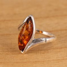 This is 925 Sterling Silver Ring & Genuine Baltic Amber.            Amber size: 6 mm x 18 mm            Amber shape: marquise            Amber colour: cognac Approx. weight : 3.1gr.                Presented in gift box.                Thank you for looking! Sterling Silver Amber Jewelry With Large Stone, Artisan Amber Sterling Silver Jewelry, Amber Stones Sterling Silver Jewelry, Silver Oval Baltic Amber Jewelry, Antique Amber-colored Sterling Silver Jewelry, Ring Marquise, Amber Color, Baltic Amber, Multi Stone