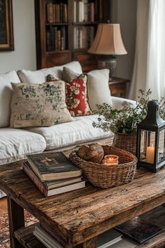 a coffee table with books and a basket on it