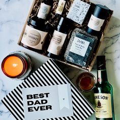 the best dad ever gift box is filled with wine, liquor and other personal care items