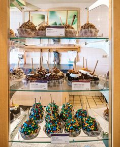 a display case filled with lots of cupcakes