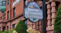 there is a sign that says library restaurant and steak house