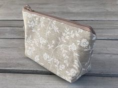 This trendy cosmetic bag is made of cotton material and is perfect size for make-up, brushes, travel items... Pouch has a soft interlining and closes with a zipper. Enough space to fit keys, cell phone, wallet, laptop charger... Measurements: Width: 7.1 inch / 18 cm Height: 4 inch / 10 cm Depth: 3.15 inch / 8 cm Feel free to contact me if you have any questions or special requests. Thank you for visiting my shop! Handmade Beige Pouch For Daily Use, Beige Fabric Pouch Bag, Beige Zipper Pouch Bag For On-the-go, Beige Zipper Pouch Cosmetic Bag For On-the-go, Compact Zipper Pouch For On-the-go, Laptop Charger, Travel Items, Small Pouches, Small Bag