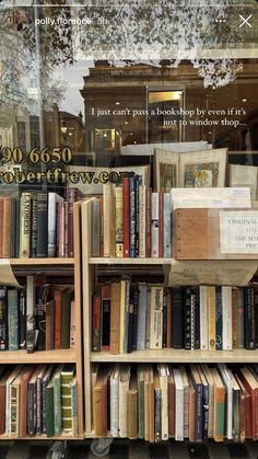 there are many books on the shelves in this store front window and one is filled with them