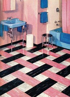 a bathroom with pink, blue and black tiles on the floor is pictured in this image